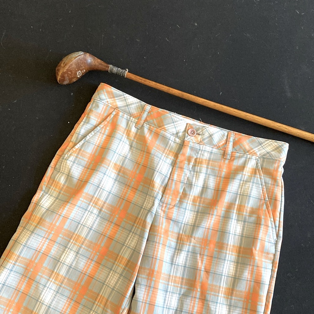 Men’s Greg Norman golf shorts size 30. Soft orange, gray, teal, white. NWOT